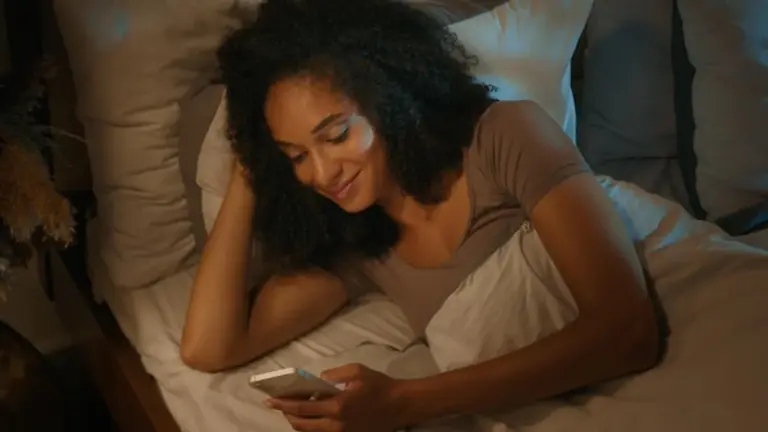 modern sleep tracking app and skincare woman night