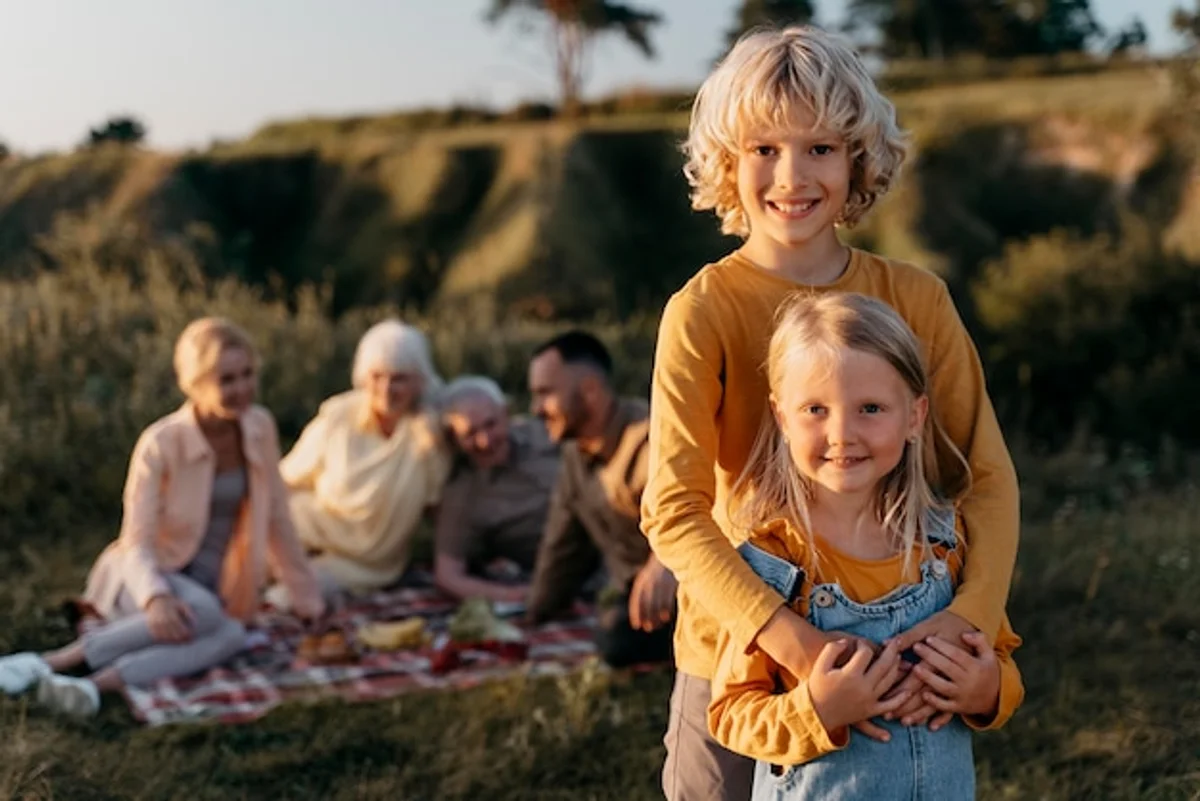 happy multigenerational family laughing during conversation at home Czech