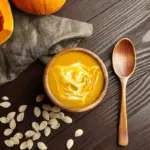 homemade creamy pumpkin soup autumn flat lay