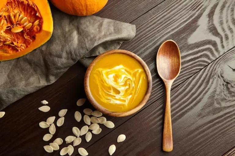 homemade creamy pumpkin soup autumn flat lay