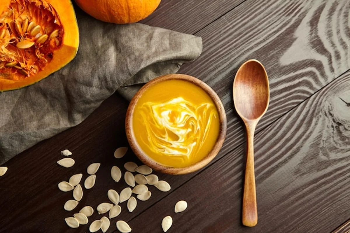 homemade creamy pumpkin soup autumn flat lay