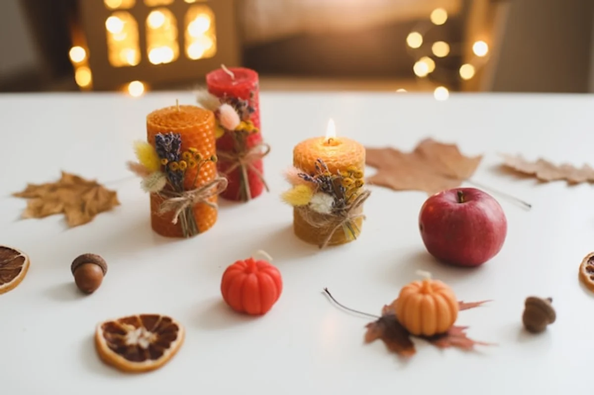 handmade candles with dried orange and cinnamon autumn vibes