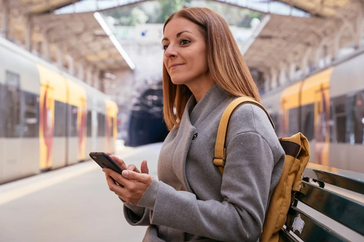 traveler using mobile phone airport public wifi security