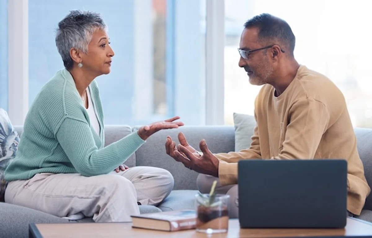 mature couple having honest conversation living room