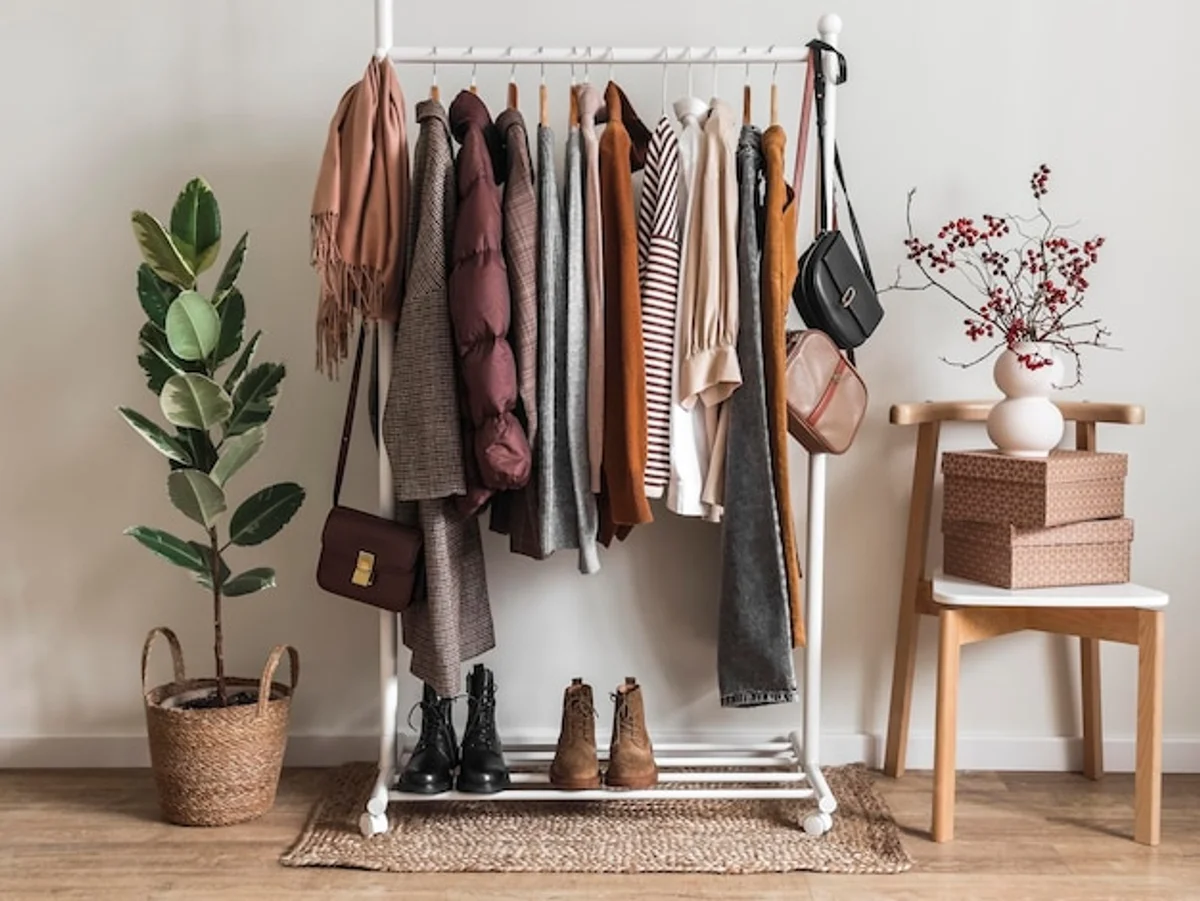 woman choosing clothes cozy autumn wardrobe