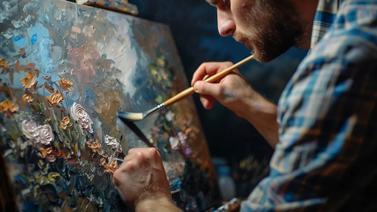 man painting watercolors at home, focus, artistic hobby
