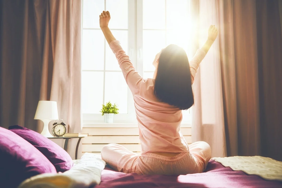 morning self-confidence ritual person window sunrise