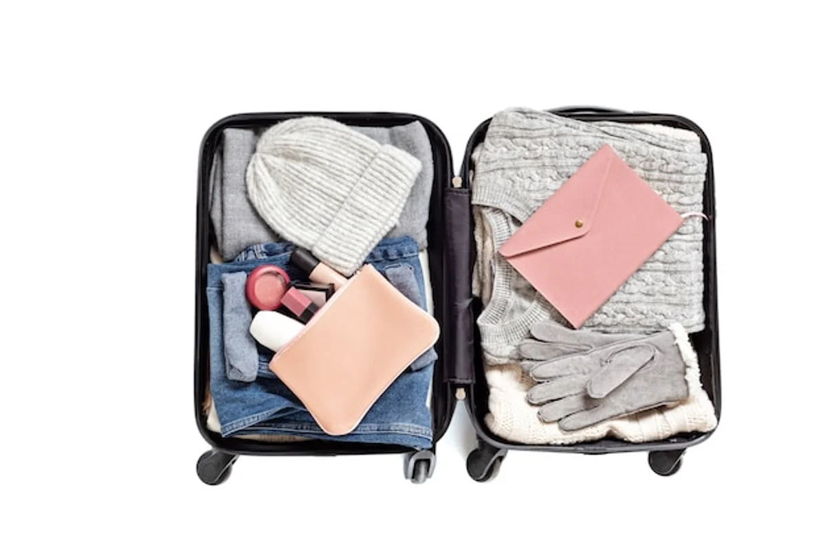packing autumn suitcase flat lay