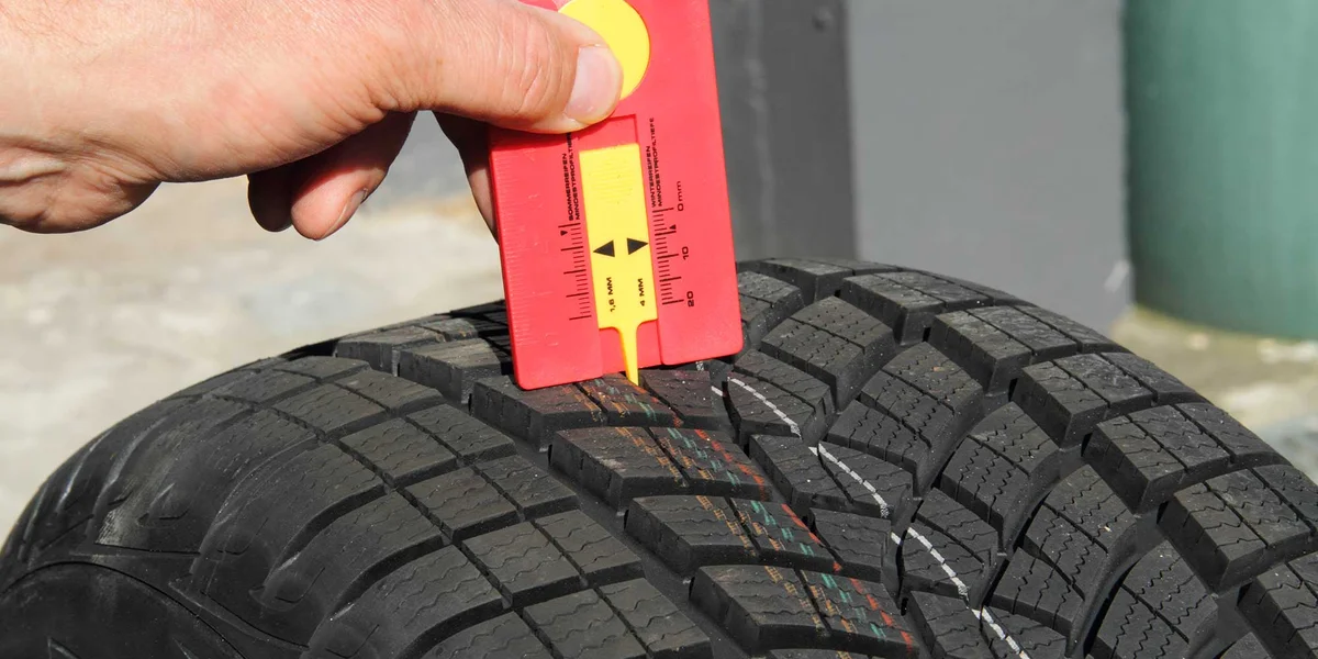 Close-up worn-out tire in cold November weather Czech Republic