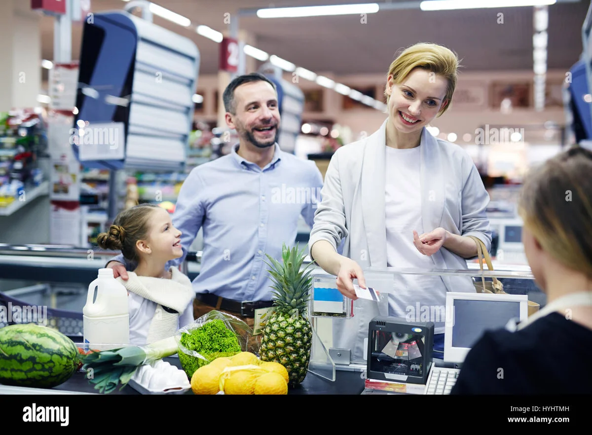 Czech family paying with cash groceries