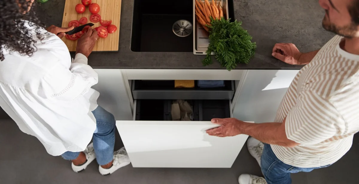 czech family sorting waste at home modern kitchen