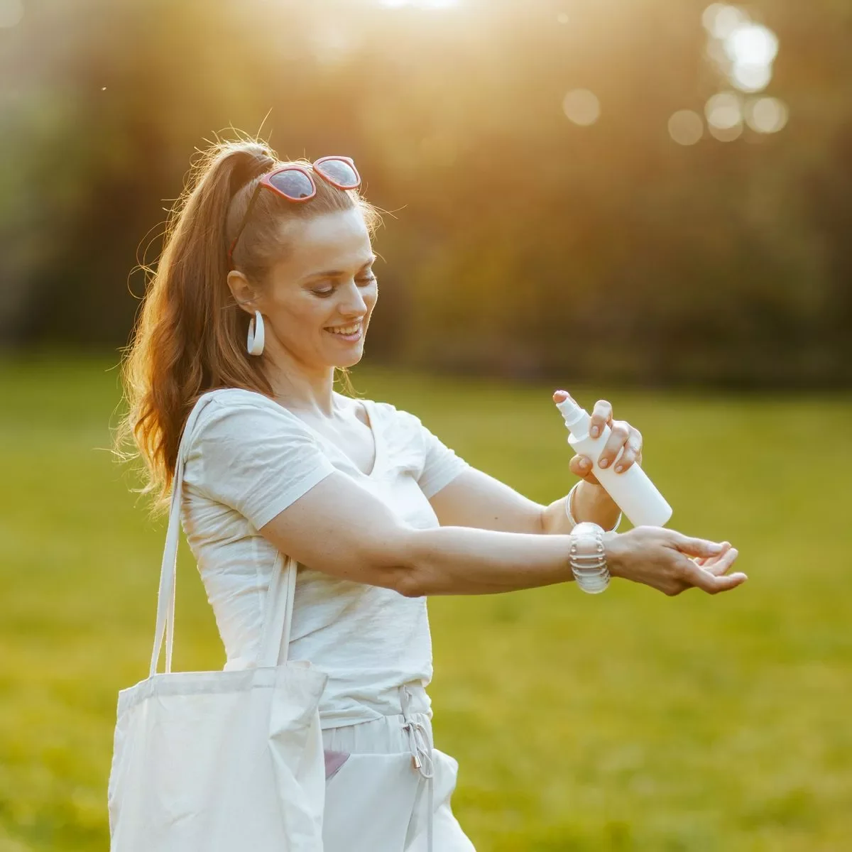 czech woman applying sunscreen park outdoor weather