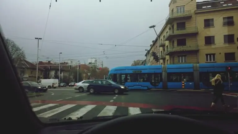 car parking during heavy rain Czech city street
