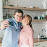 happy interracial european couple relationship real life kitchen laughter