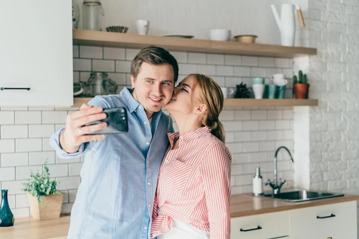 happy interracial european couple relationship real life kitchen laughter