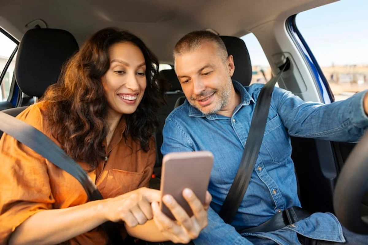 family using gps navigation on tablet during European road trip