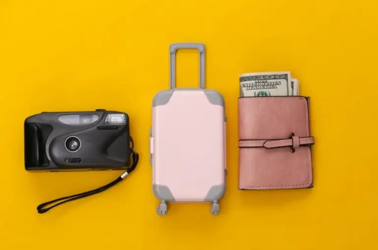 travel packing suitcase flat lay minimal style