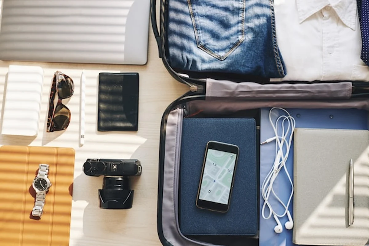 packing travel gadgets electronics suitcase