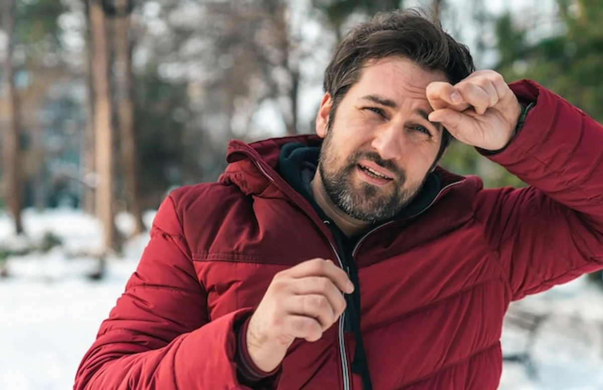 man jogging in snowy park morning motivation