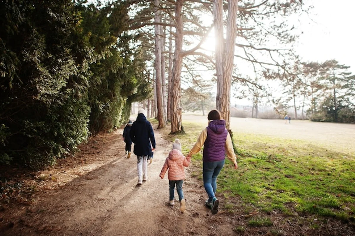 happy family with children hiking in autumn forest Czech Republic
