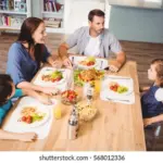 relaxed czech family discussing home repairs around table