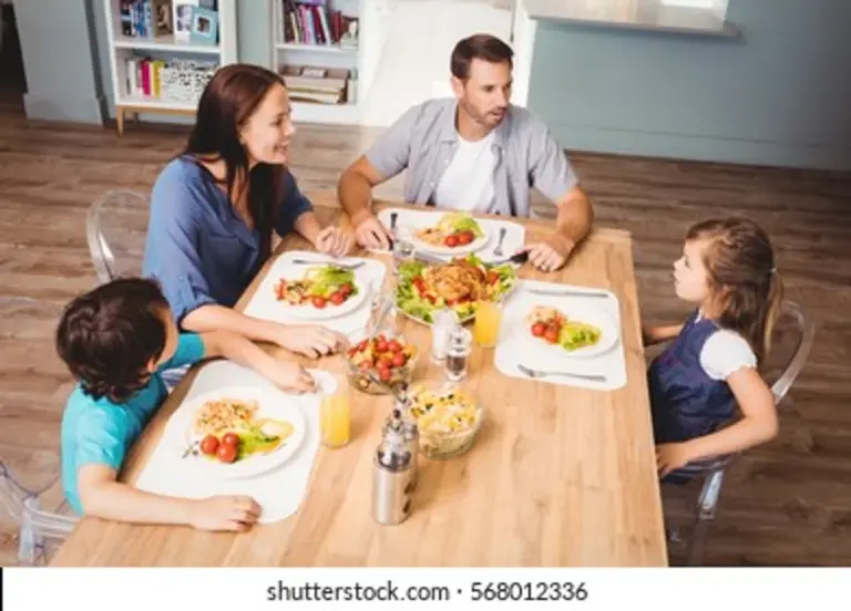 relaxed czech family discussing home repairs around table