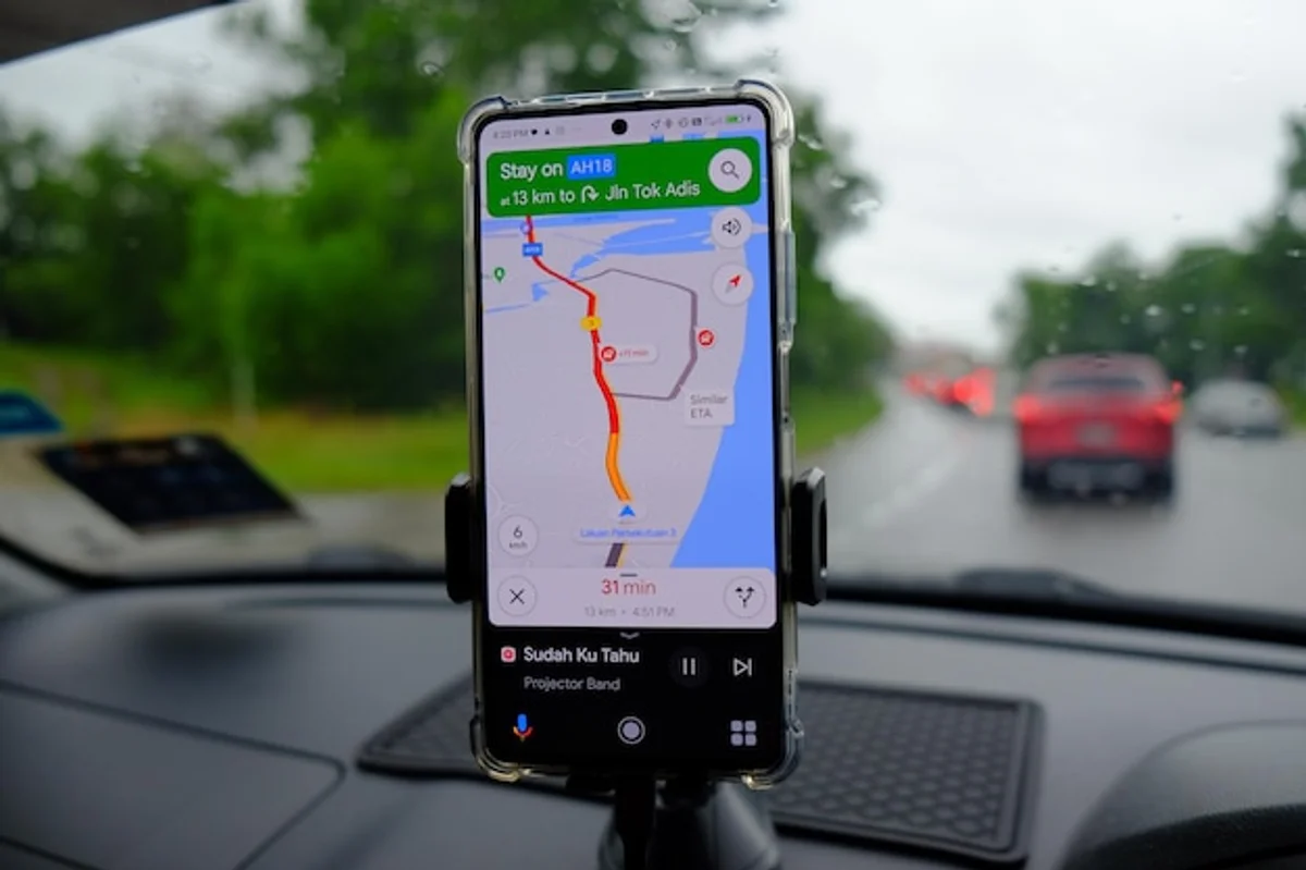 rainy road navigation app dashboard car interior