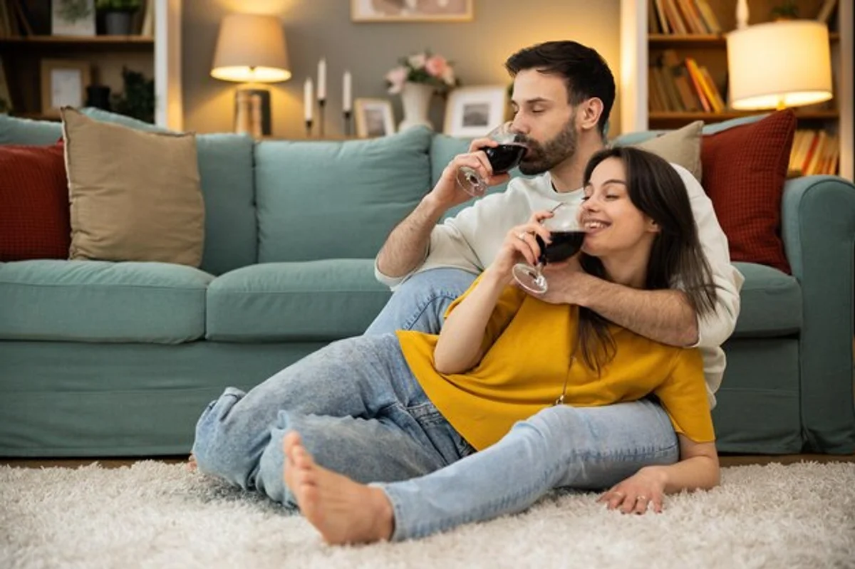 couple watching movie online living room wine virtual date