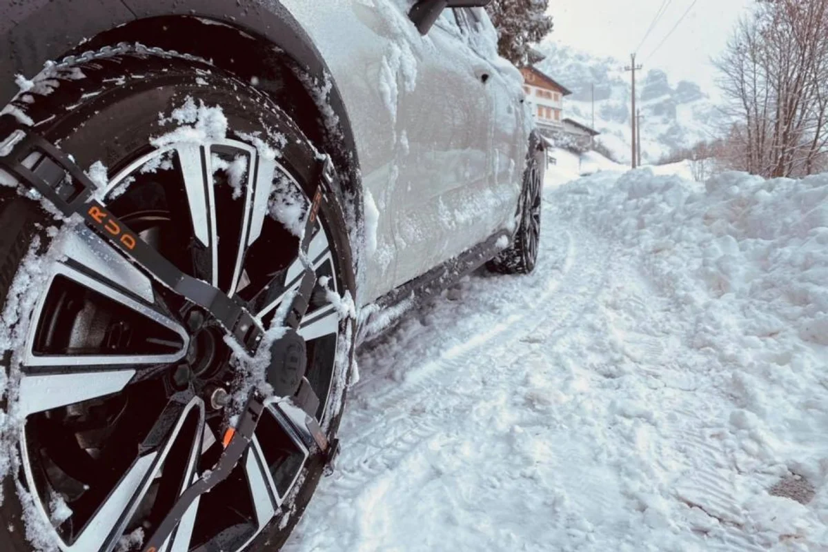 car snow chains in alpine mountains winter roads
