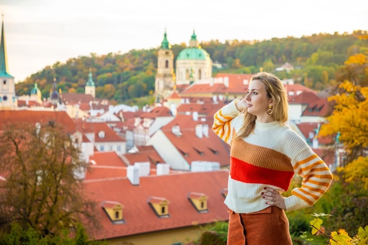 czech travelers planning trip with smartphone autumn