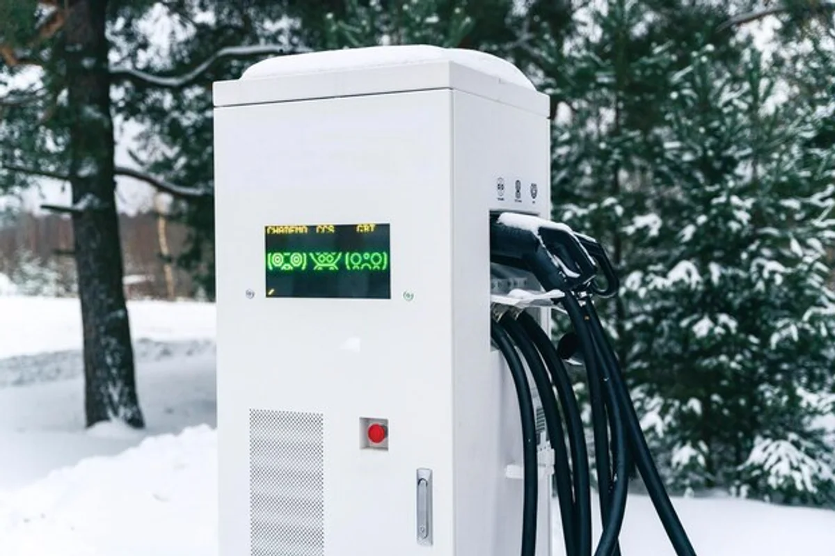 electric car charging in winter snow
