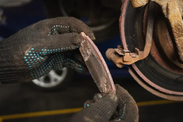 close-up car brake pads inspection safety