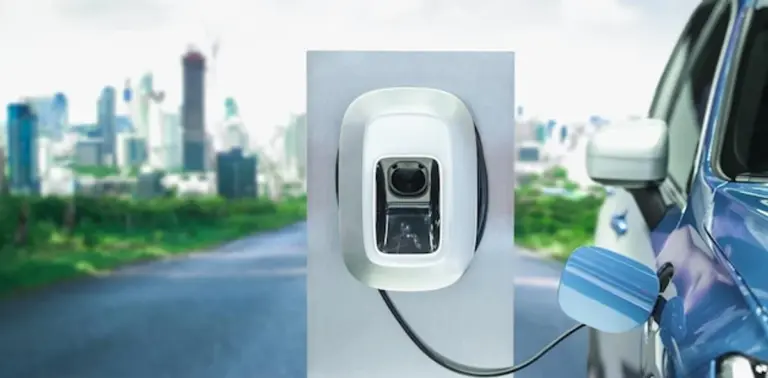electric car charging in Europe city autumn modern concept