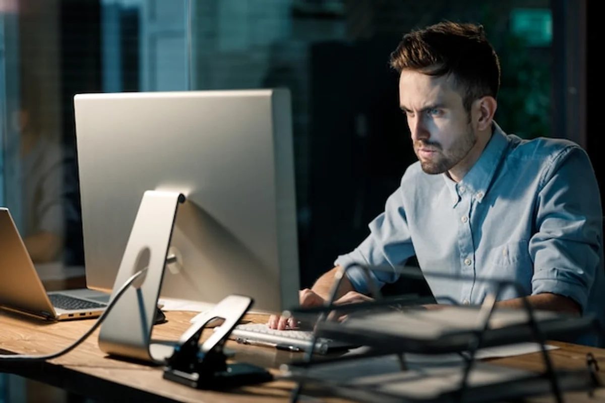 focused office worker with technology gadgets productivity