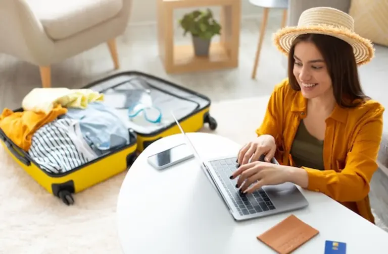 happy family booking summer vacation on laptop Europe