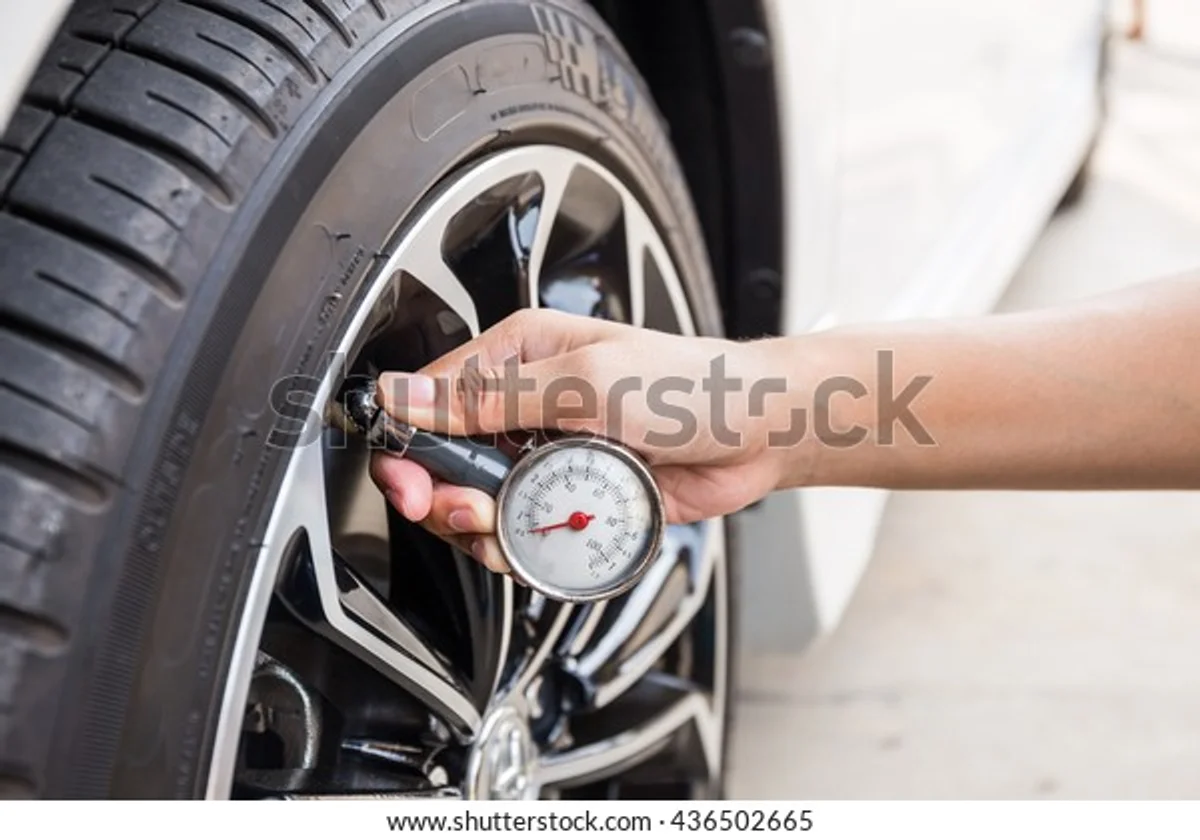 close up check tire pressure czech car highway