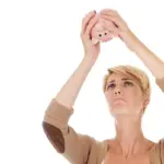 stressed person looking at empty piggy bank