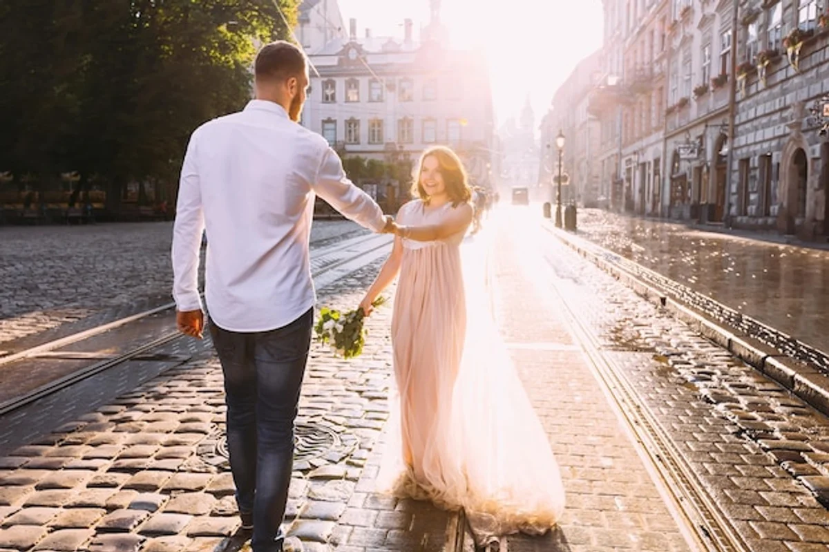 romantic couple old hands walking in Prague sunrise