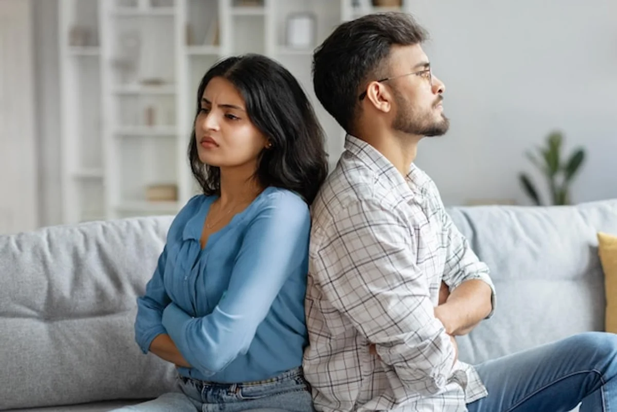 couple having a deep conversation at home in the evening