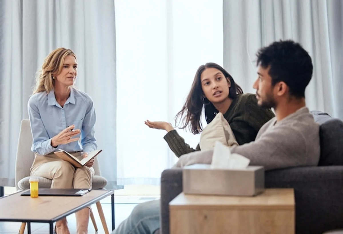 conflict resolution between adults sitting and talking in modern office